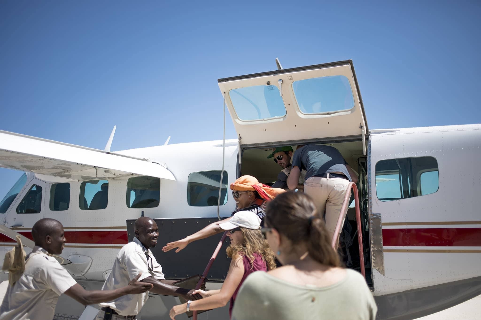 Passengers boarding a small plane.