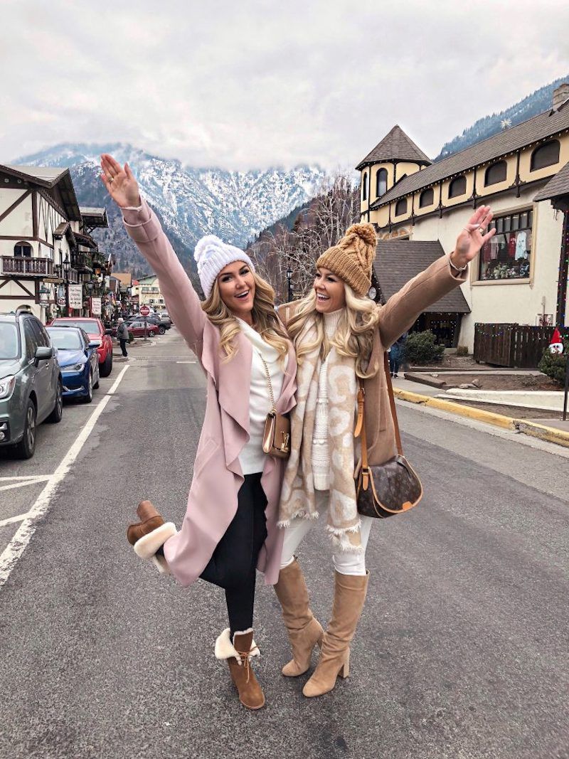 Sisters posing in a European village street.