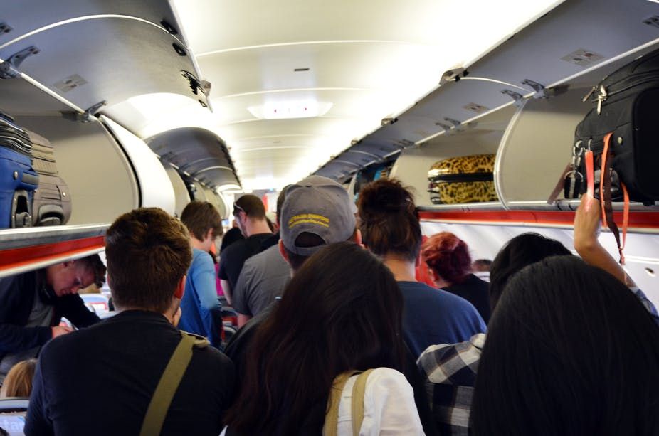 Passengers disembarking a plane.
