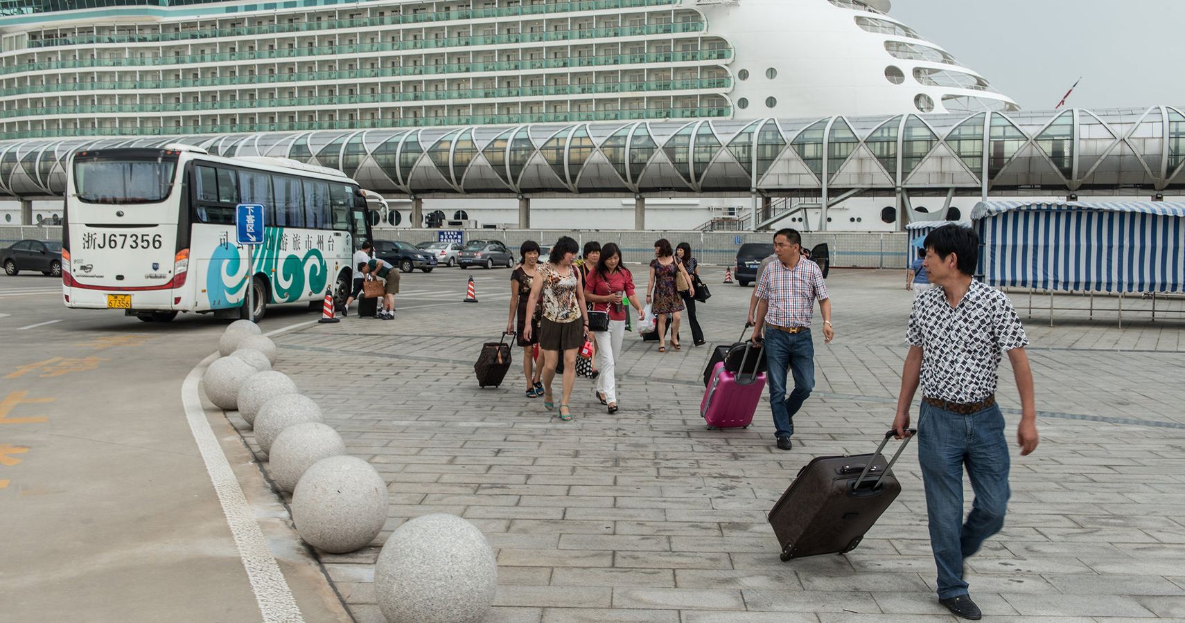 Asian passengers leaving cruise ship