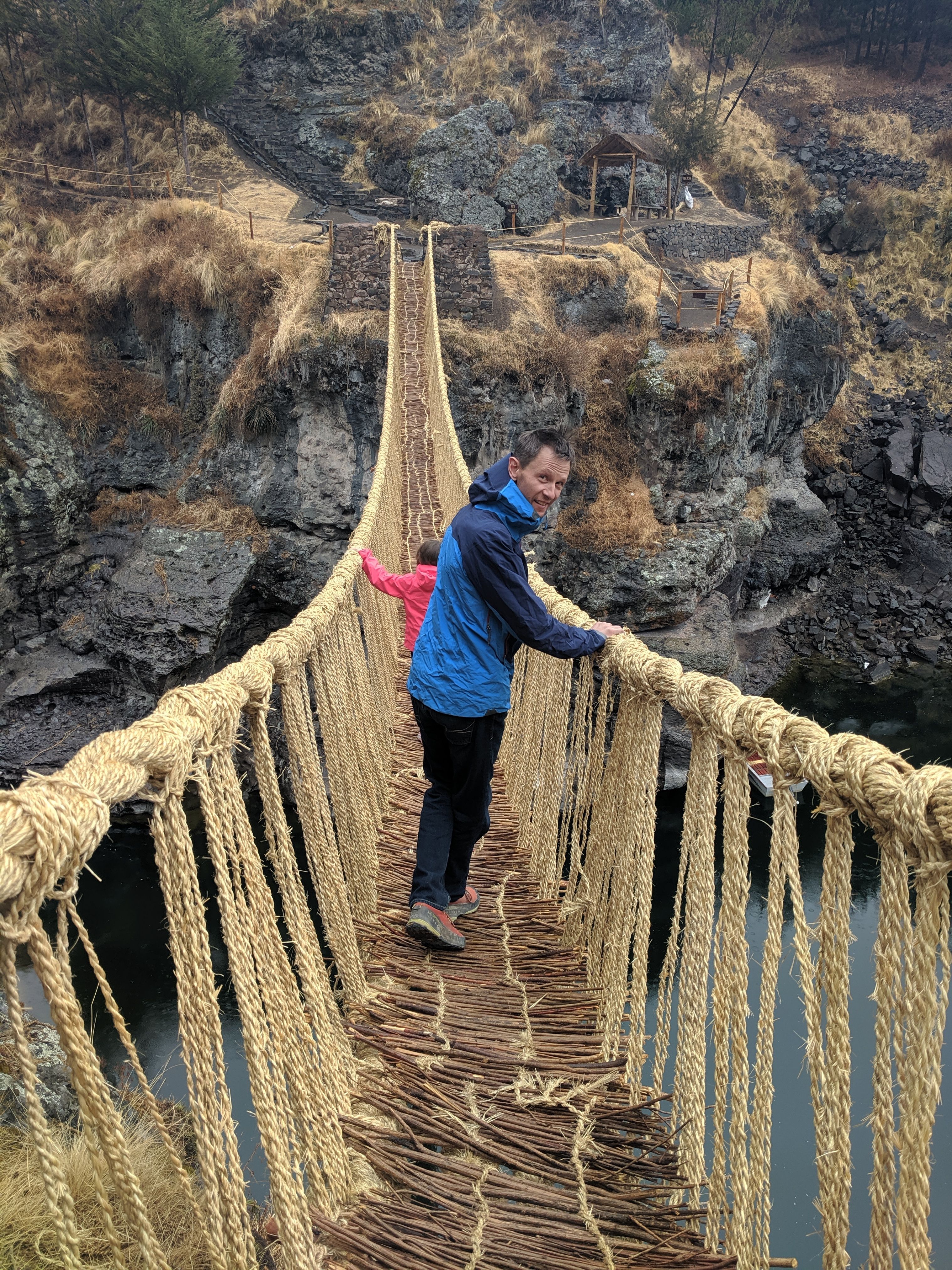 Man crossing Inca bridge