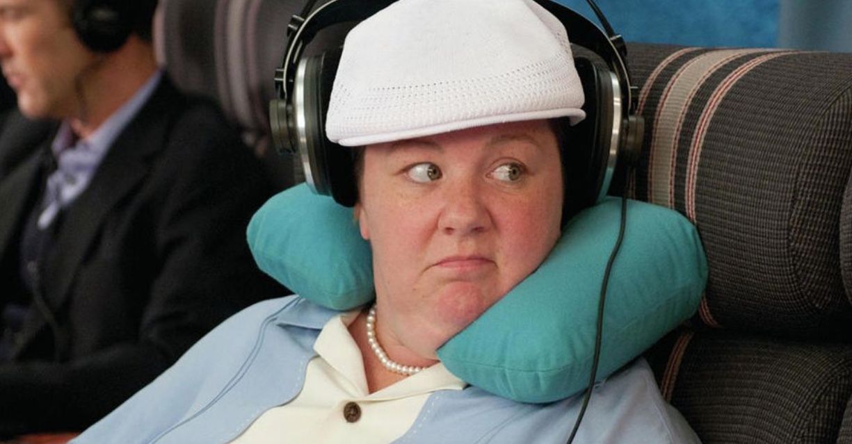 bridesmaid actress with headphones and head pillow