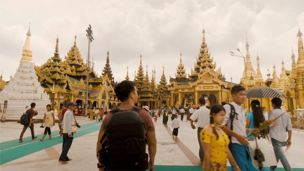 Man walking towards Myannmar pagodas