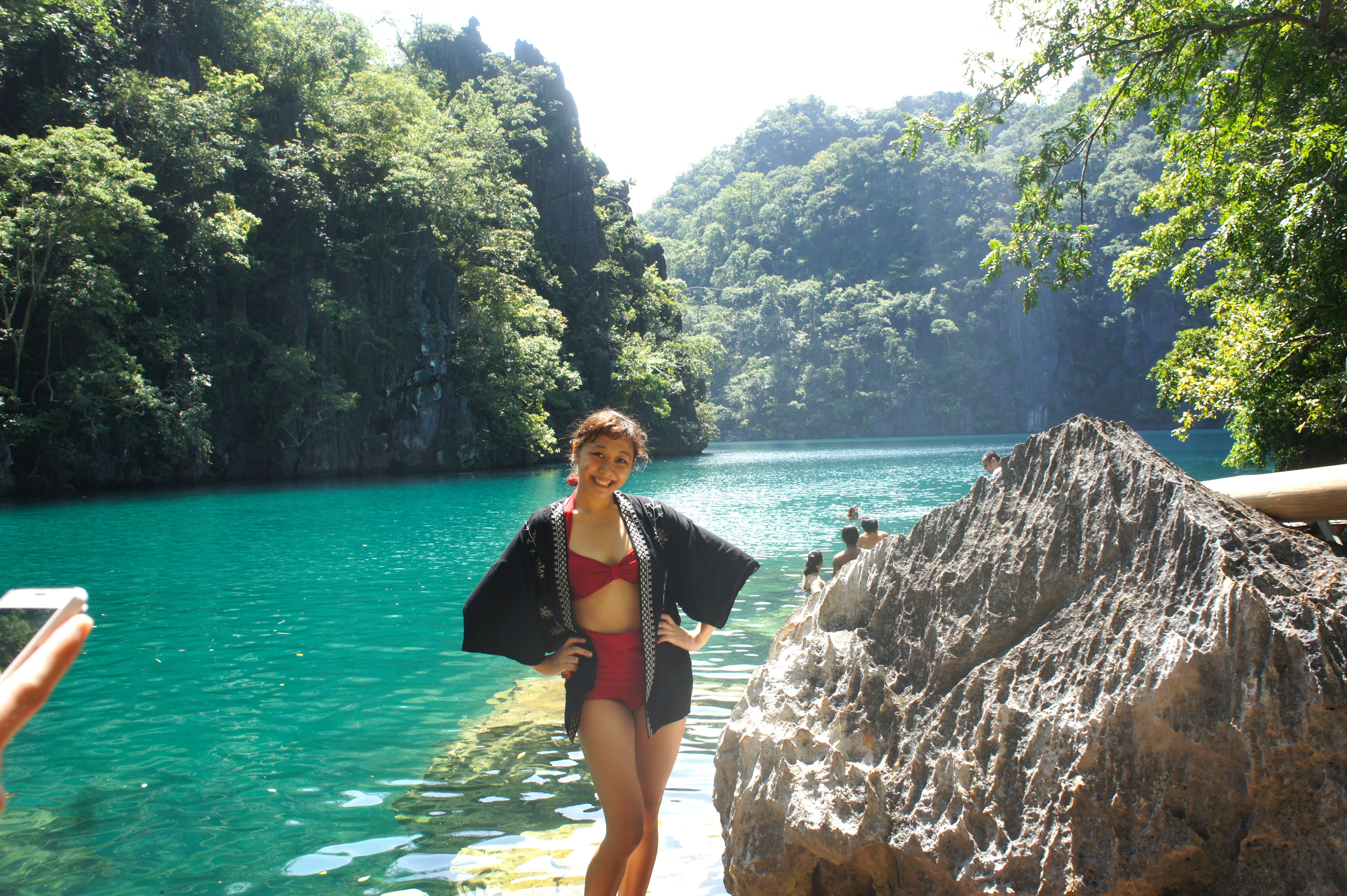 Woman standing on shore at Palawan