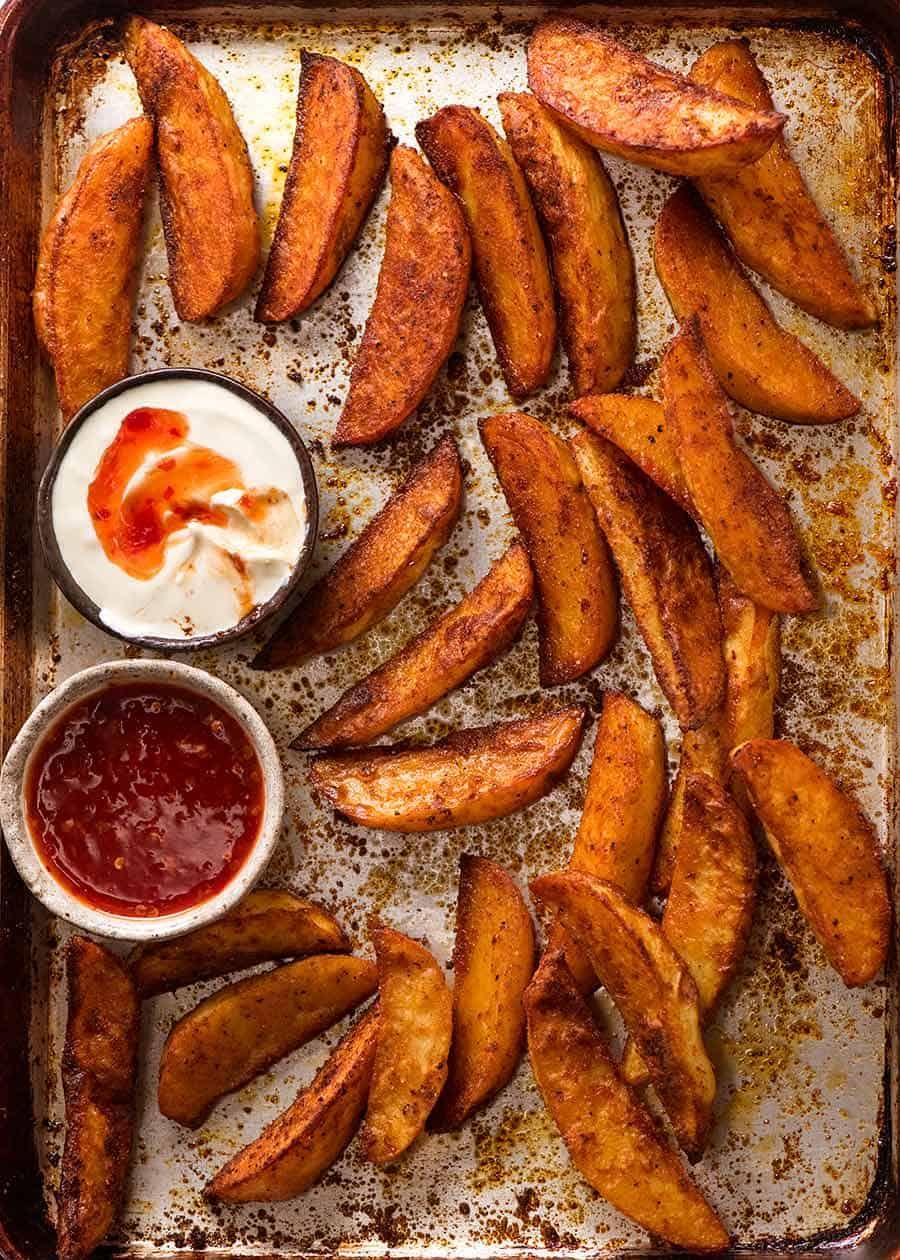 potato wedges with sour cream and sweet chile sauce are yummy australian snack
