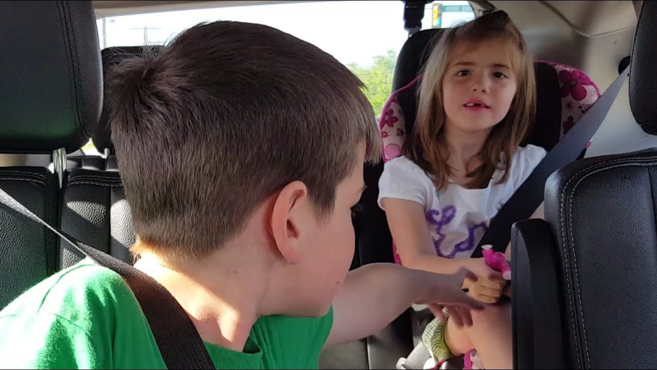 Siblings squabble during car ride