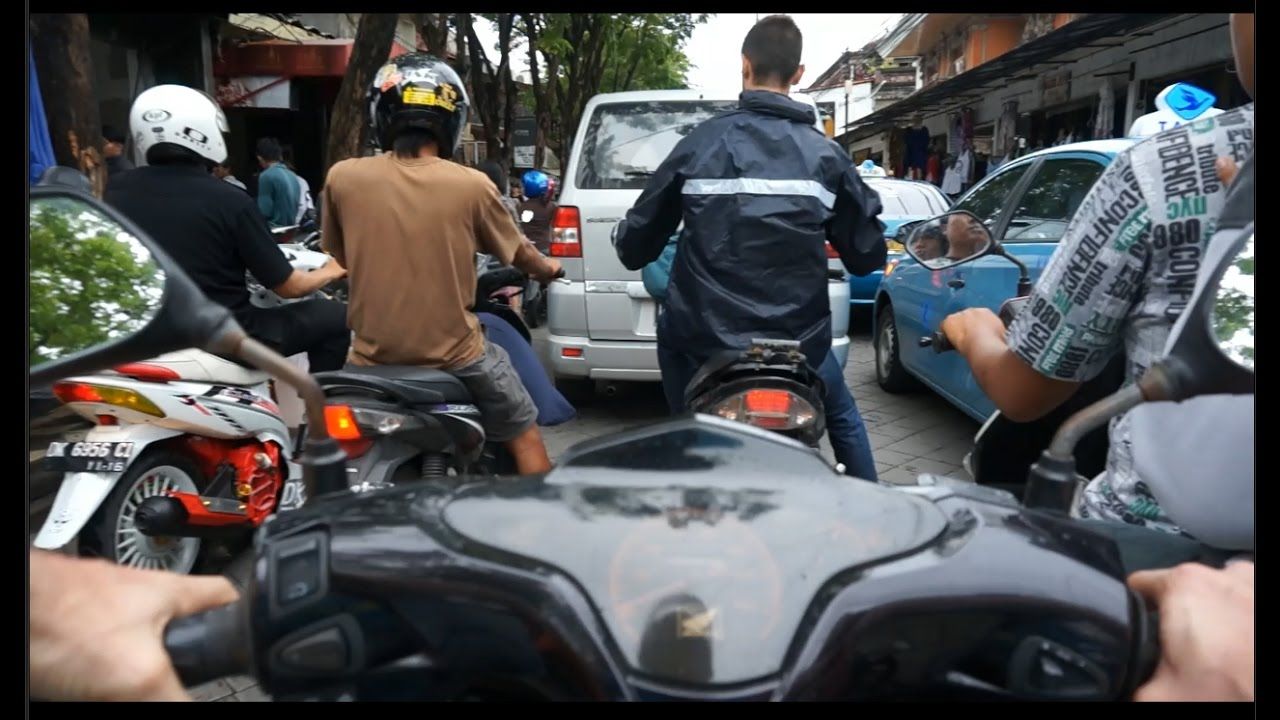Riding through the streets on a motorbike in bali traffic