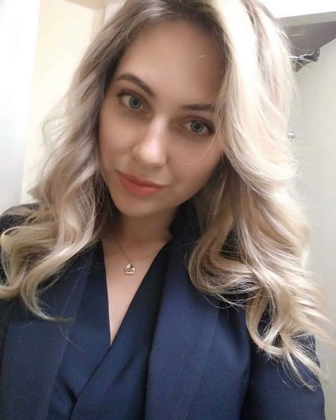 Blonde woman looking into the camera