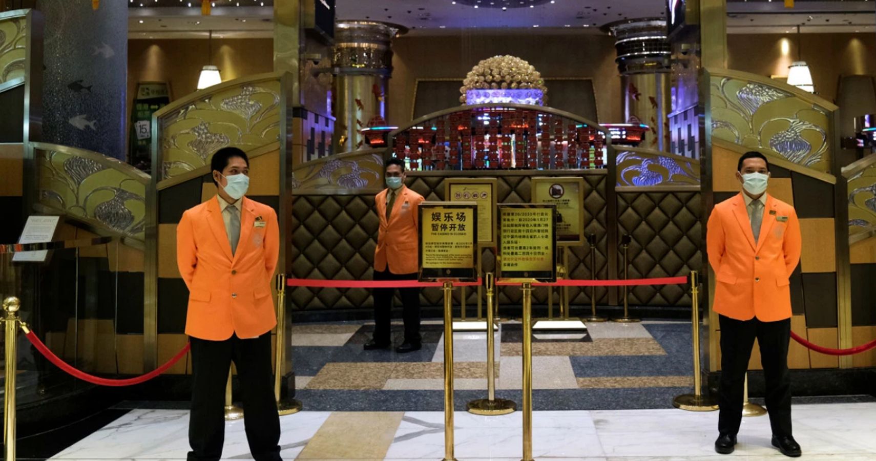Maasked attendants outside Macau casino
