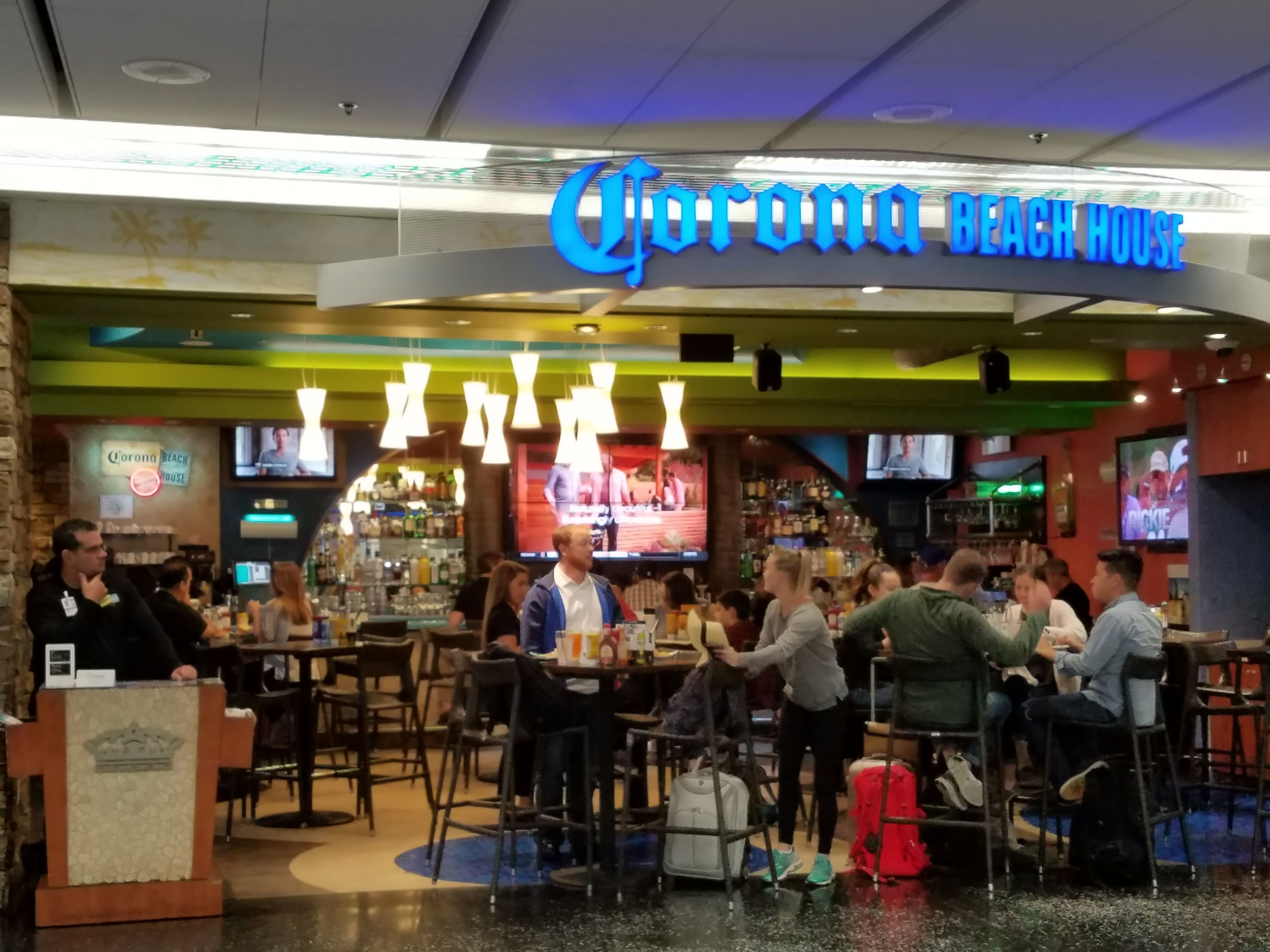 People sitting at an airport bar