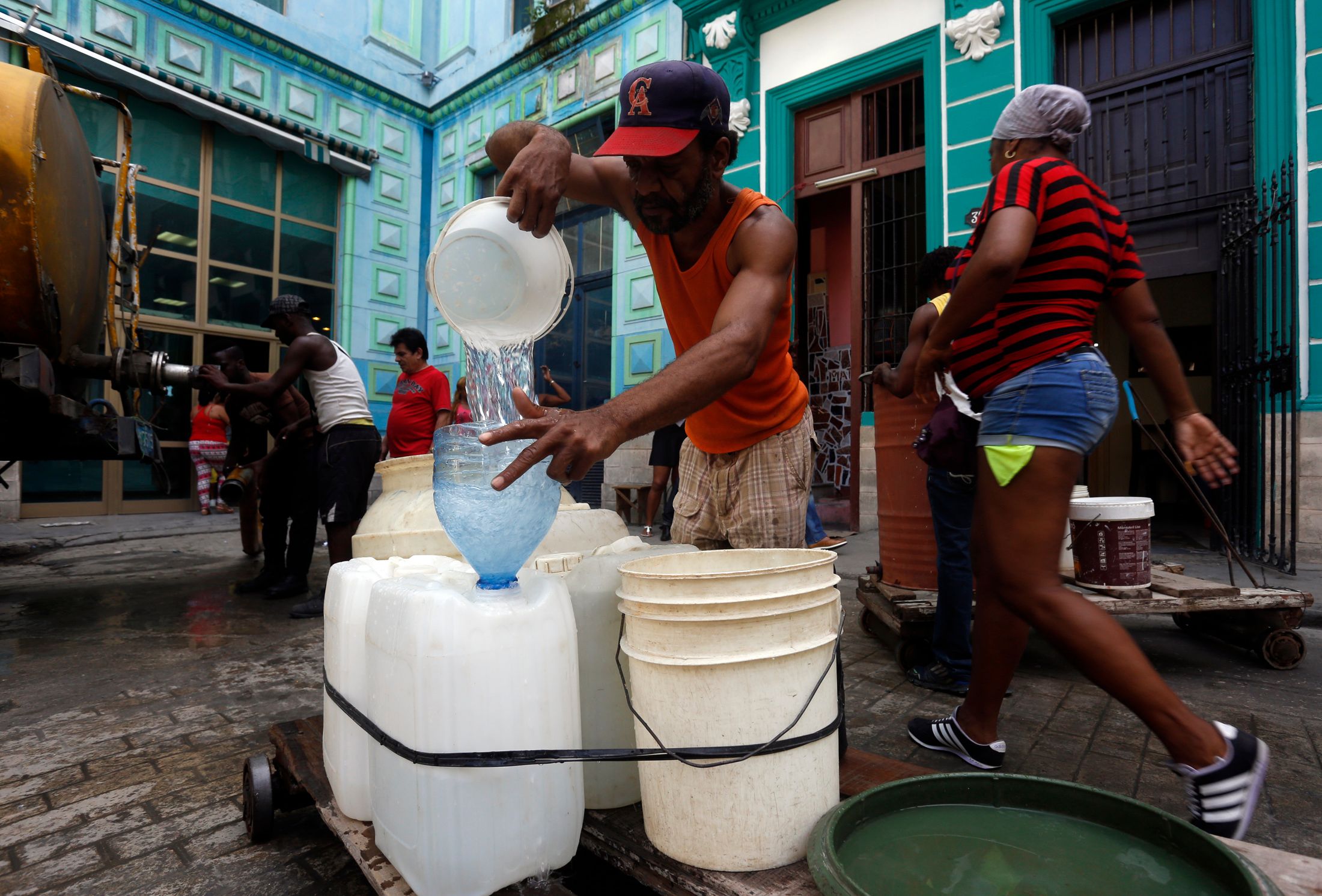 A person pouring water in Cuba
