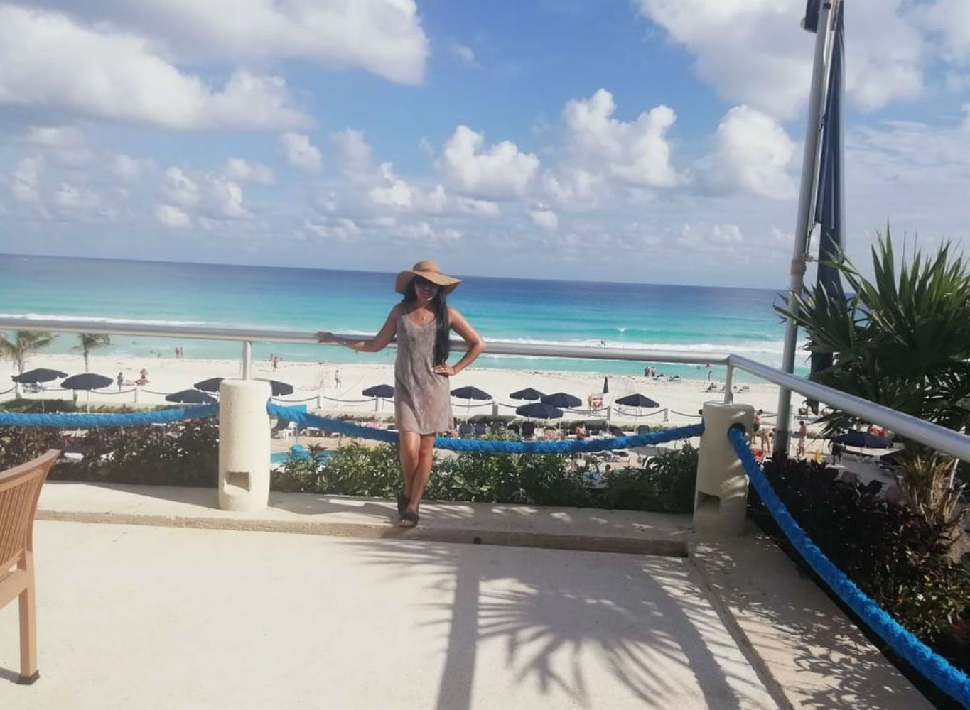 woman standing in front of ocean at resort
