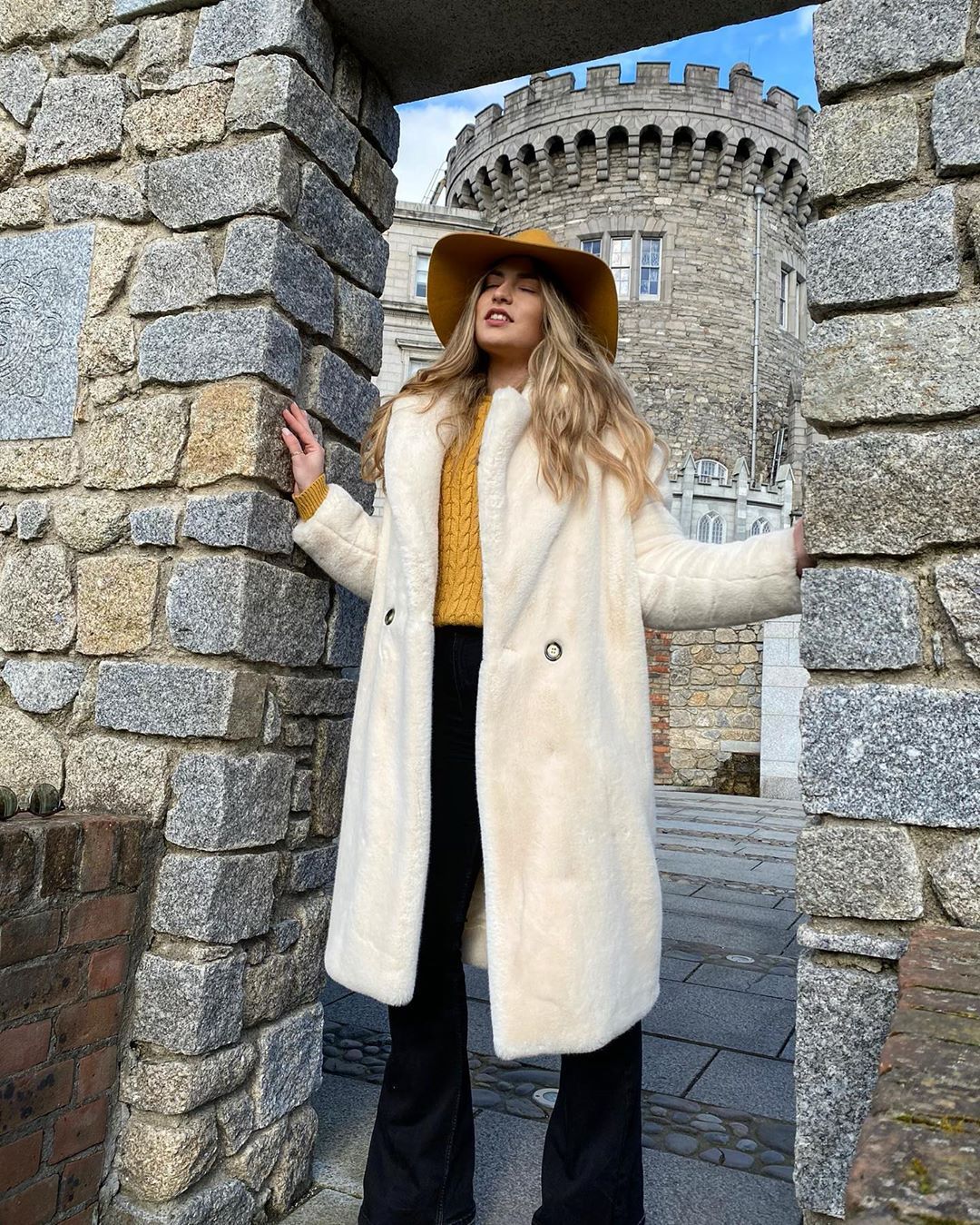 tourist in white coat at dublin castle