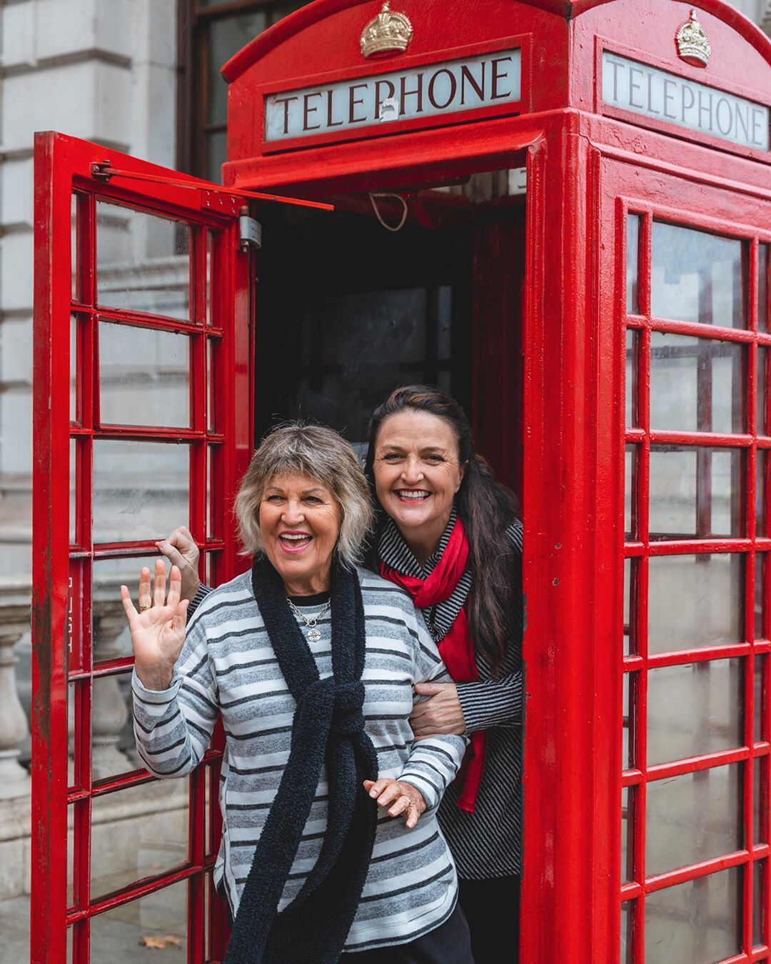 two women in london phonebooth