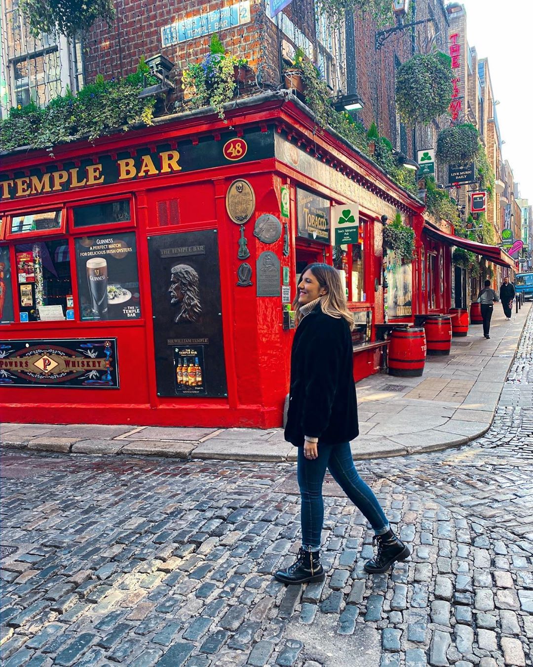 woman in front of temple bar in dublin