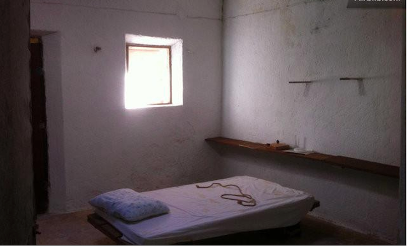 Twin Bed In Cell Like Room