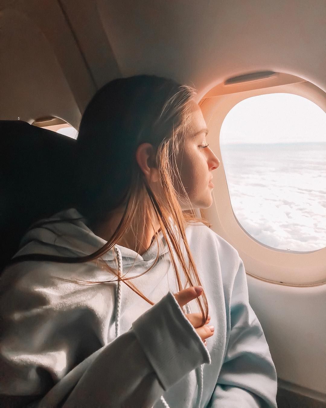 girl sitting on plane
