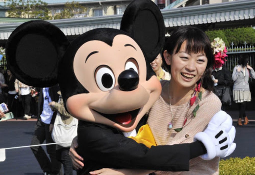 Mickey Mouse with a fan at Tokyo Disney