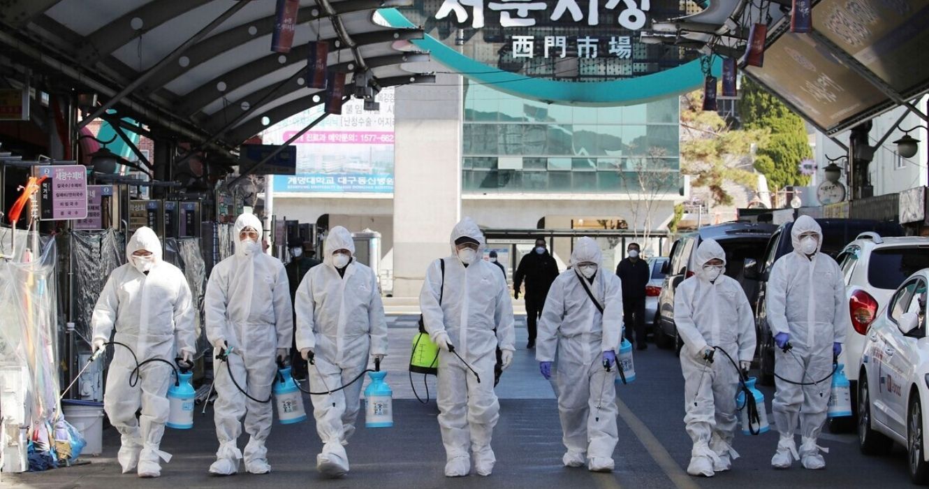 trained professionals clean the streets of south korea during the covid-19 pandemic