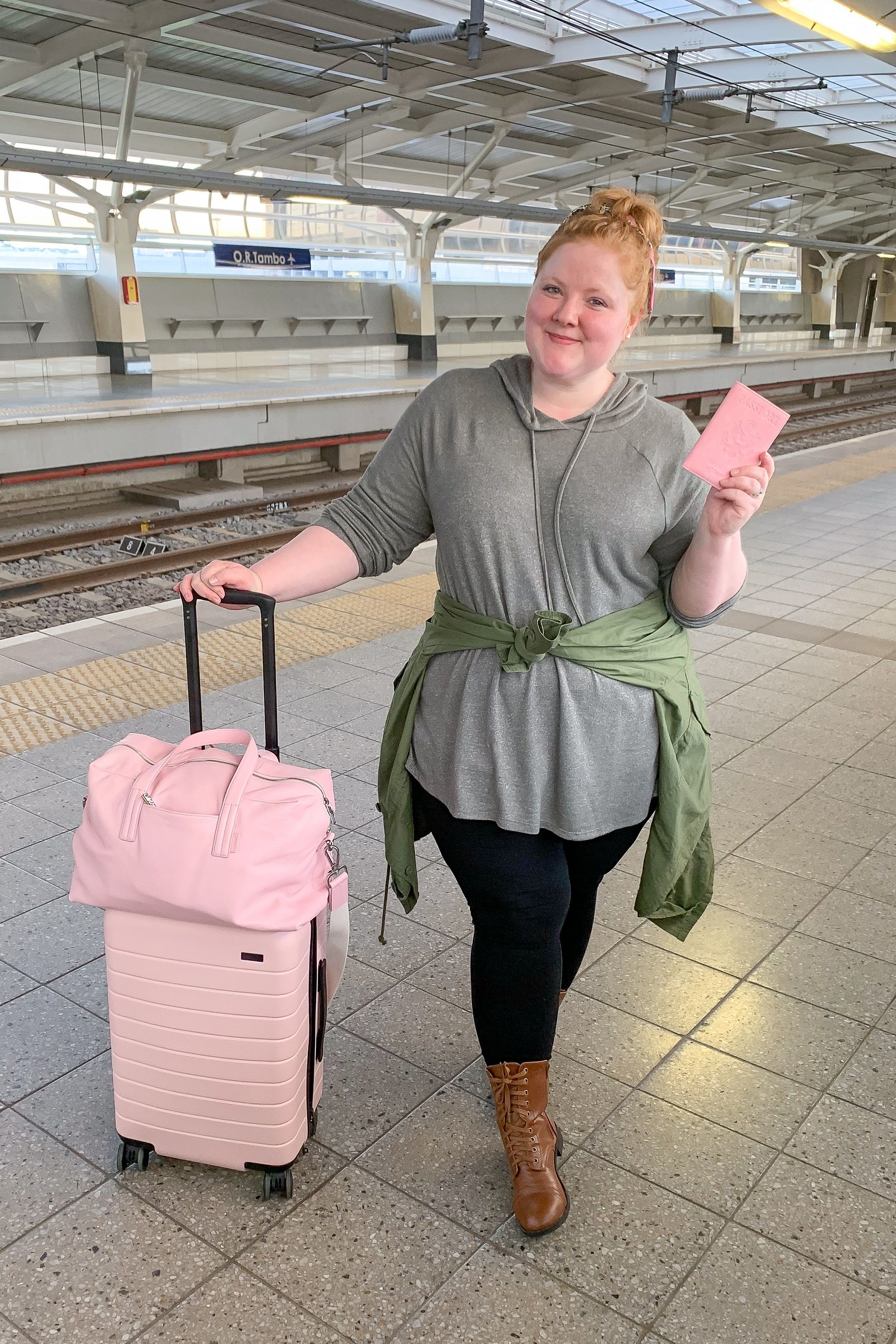 Woman with pink luggage