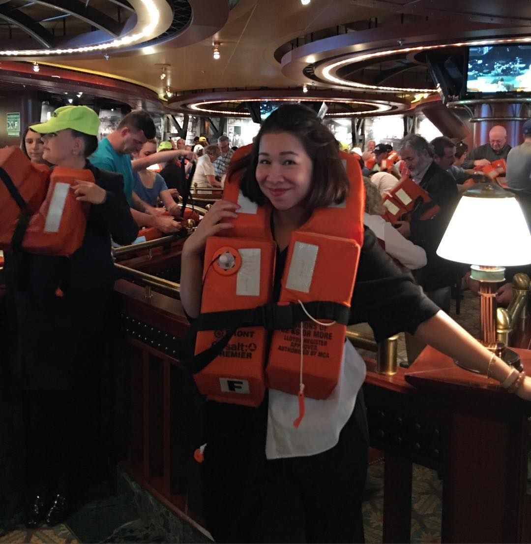 person wearing a life vest for cruise safety