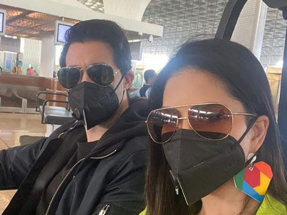 couple in masks at airport