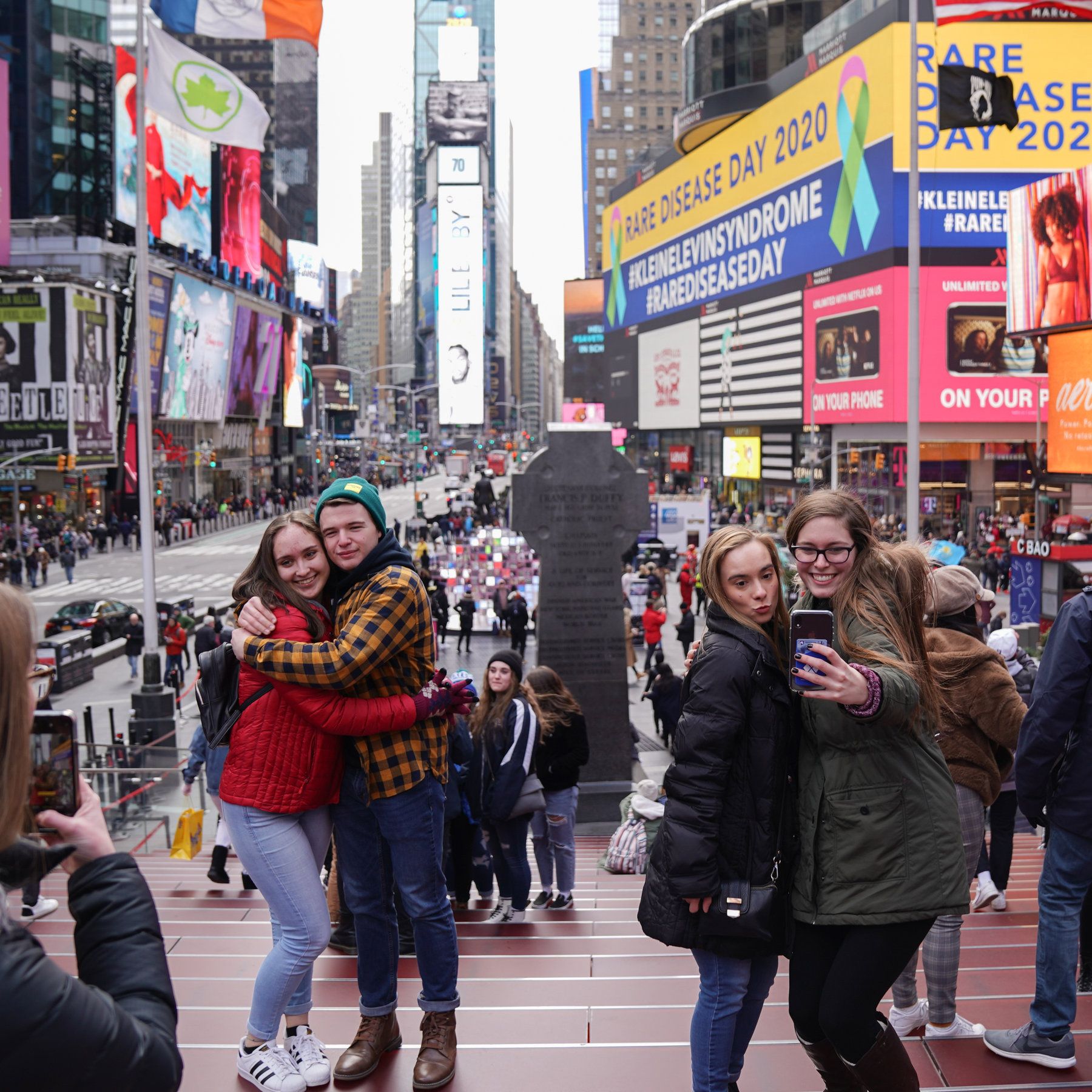 Crowds of tourists posing in NYC despite the coronavirus pandemic.