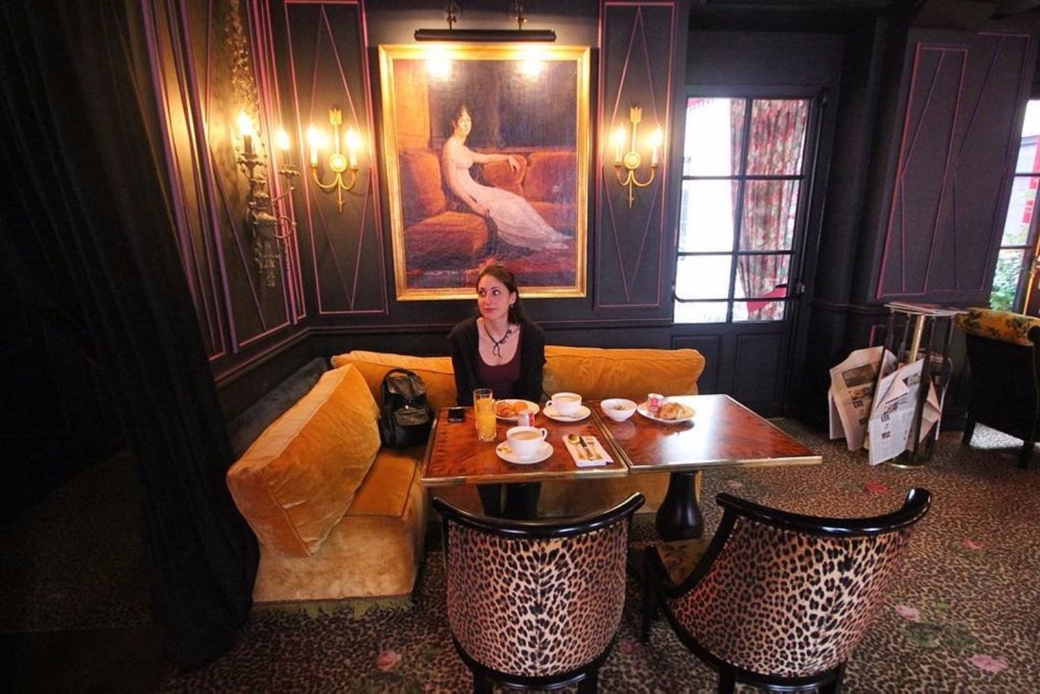woman sitting in hotel restaurant in paris