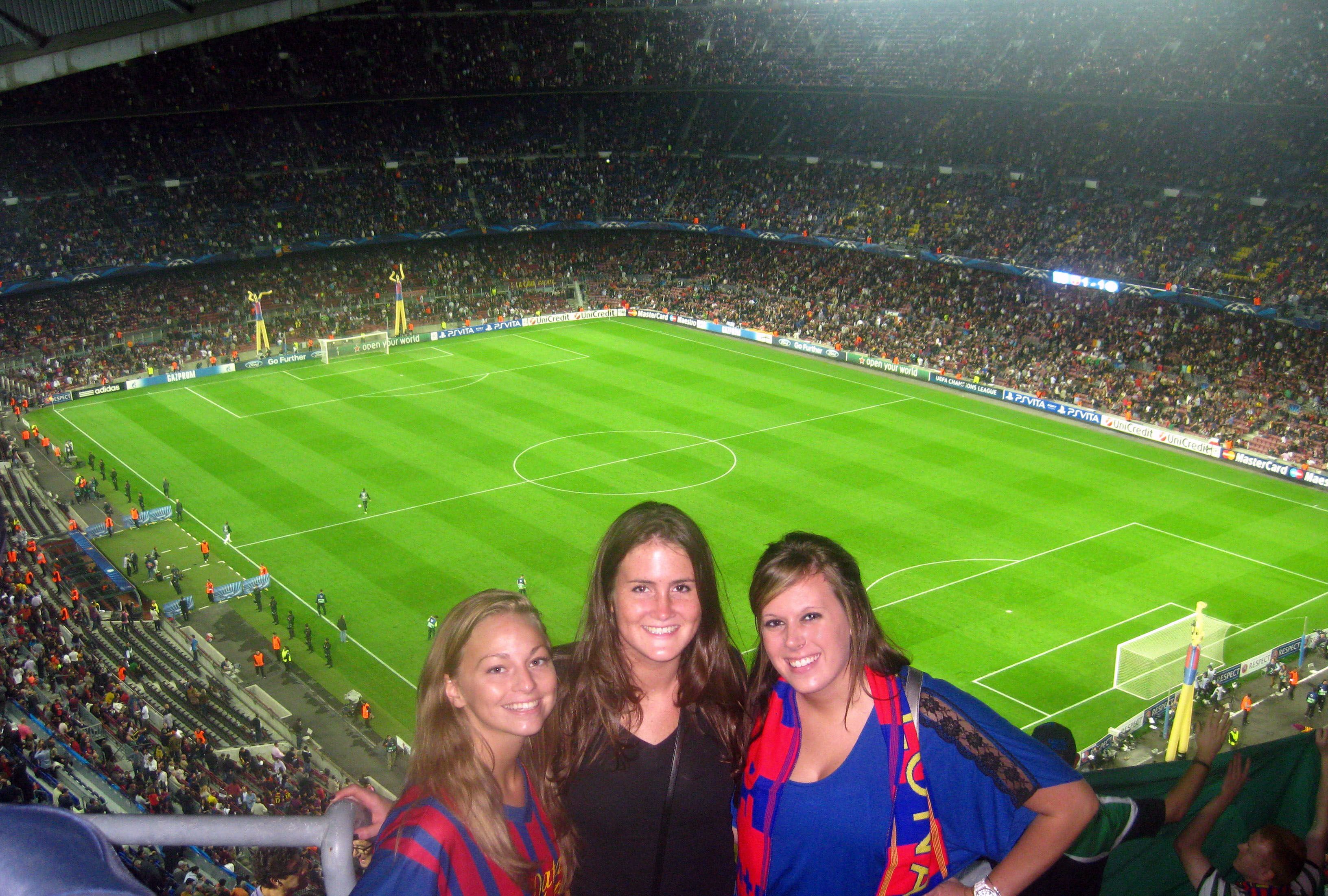 Girls attend Barcelona FC soccer game in Spain