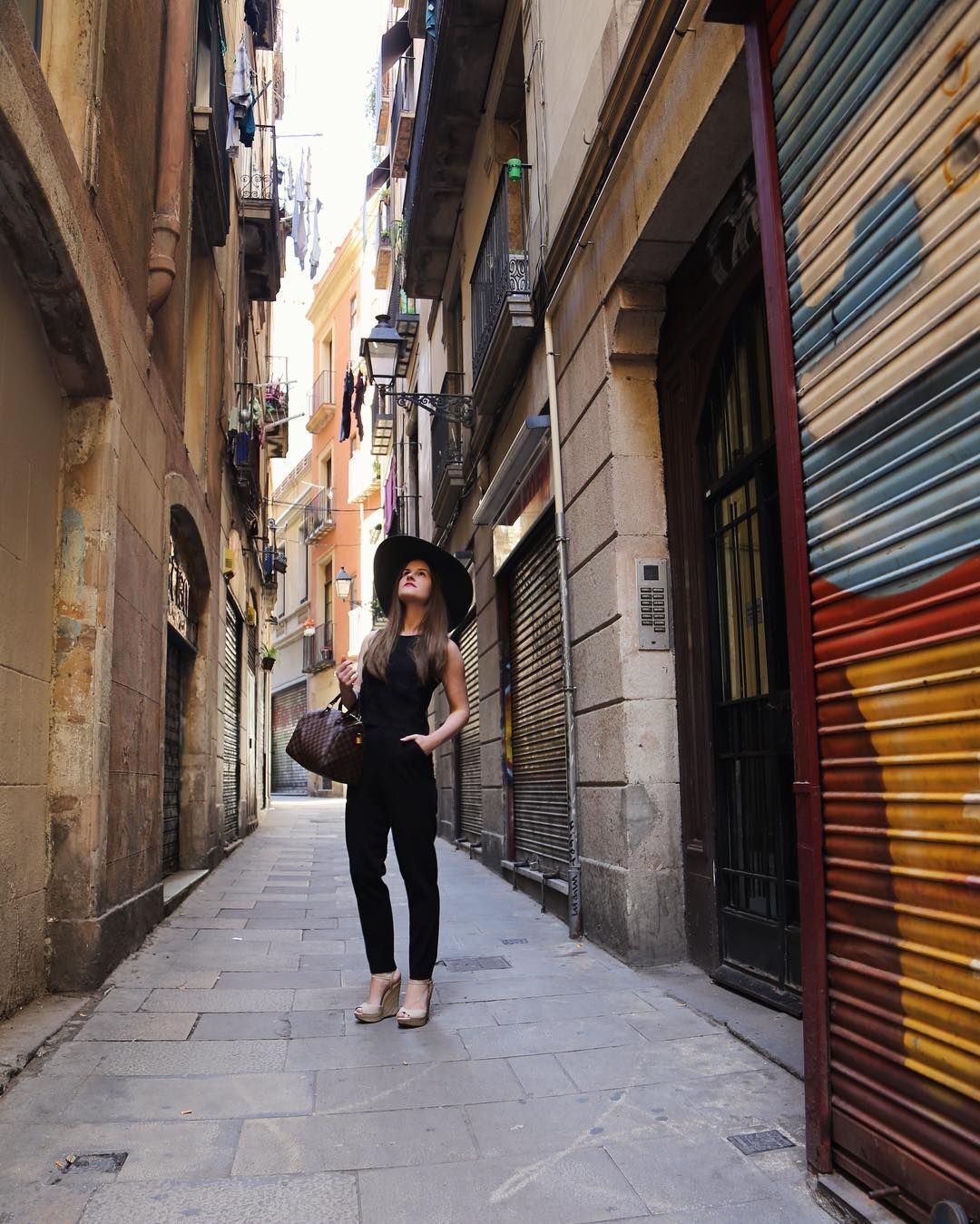 Tourist walking through the gothic quarter in Barcelona