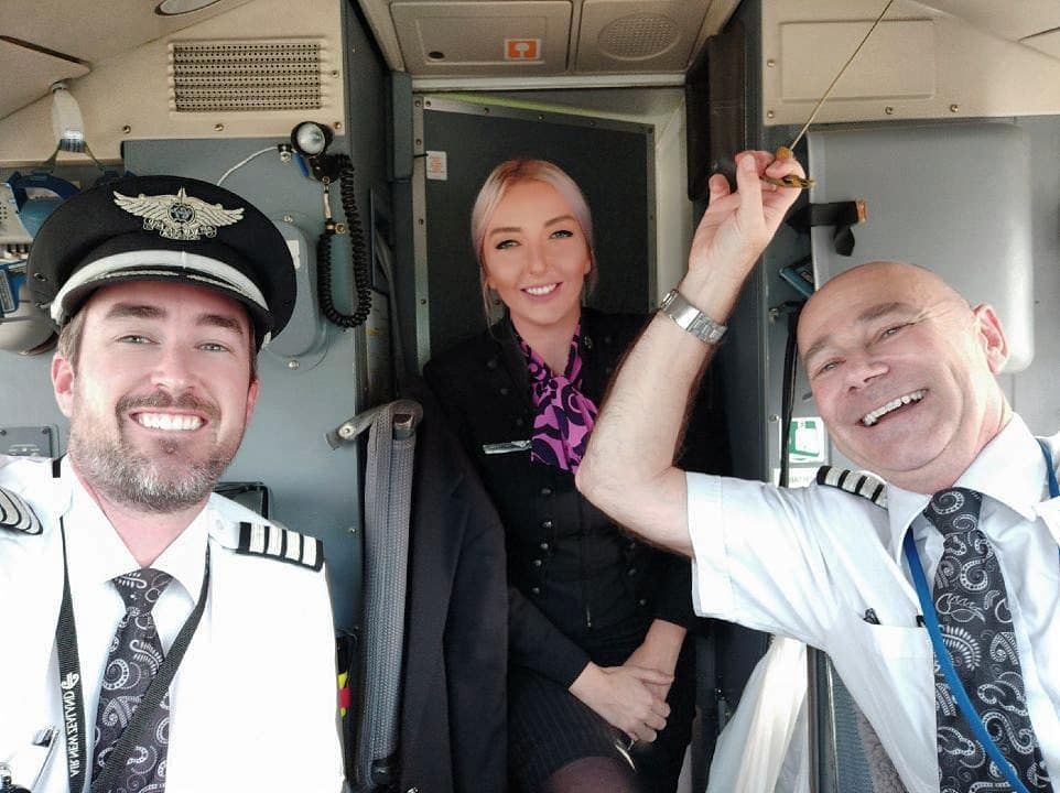 Flight attendant hanging out with captains