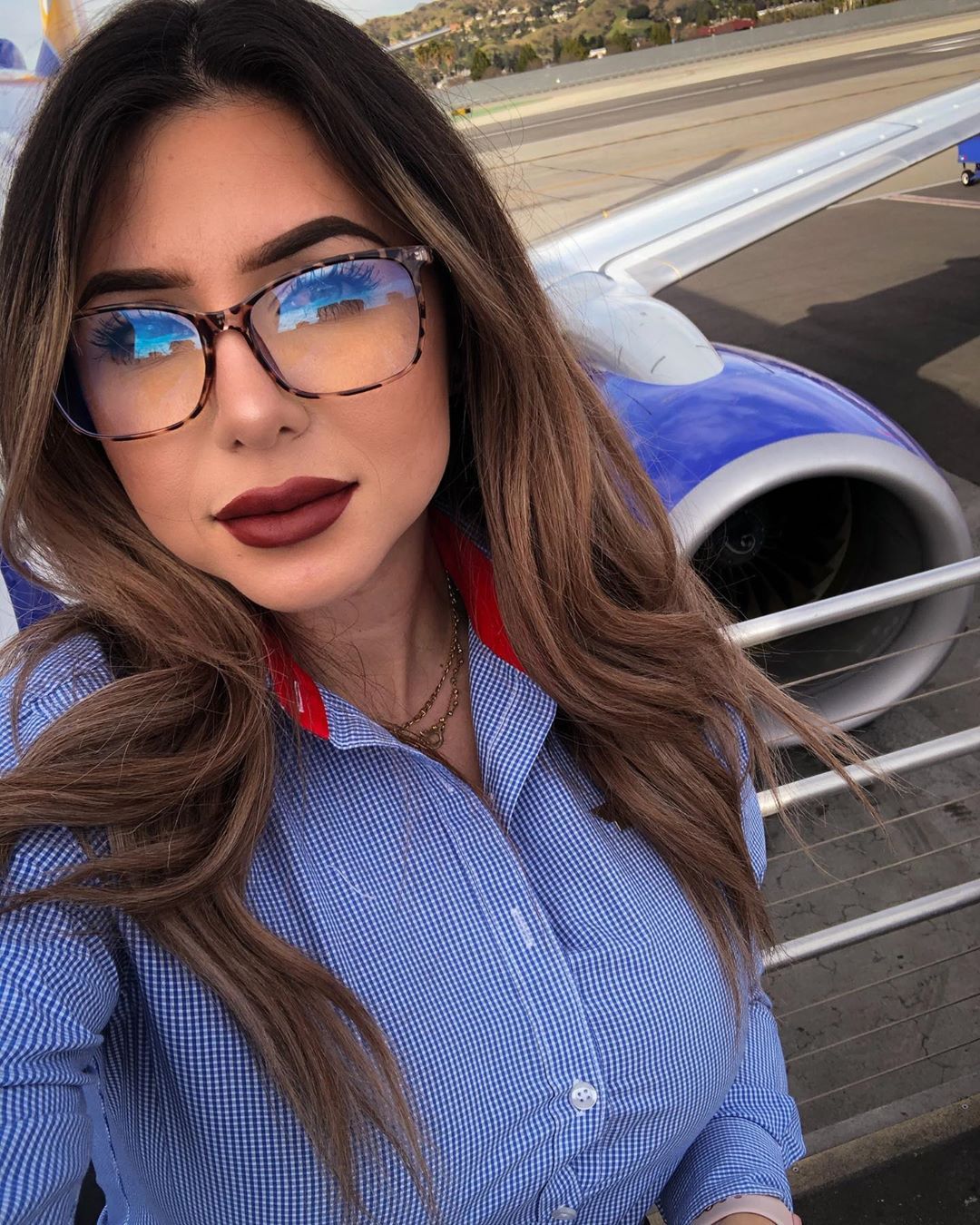 Flight attendant wearing glasses