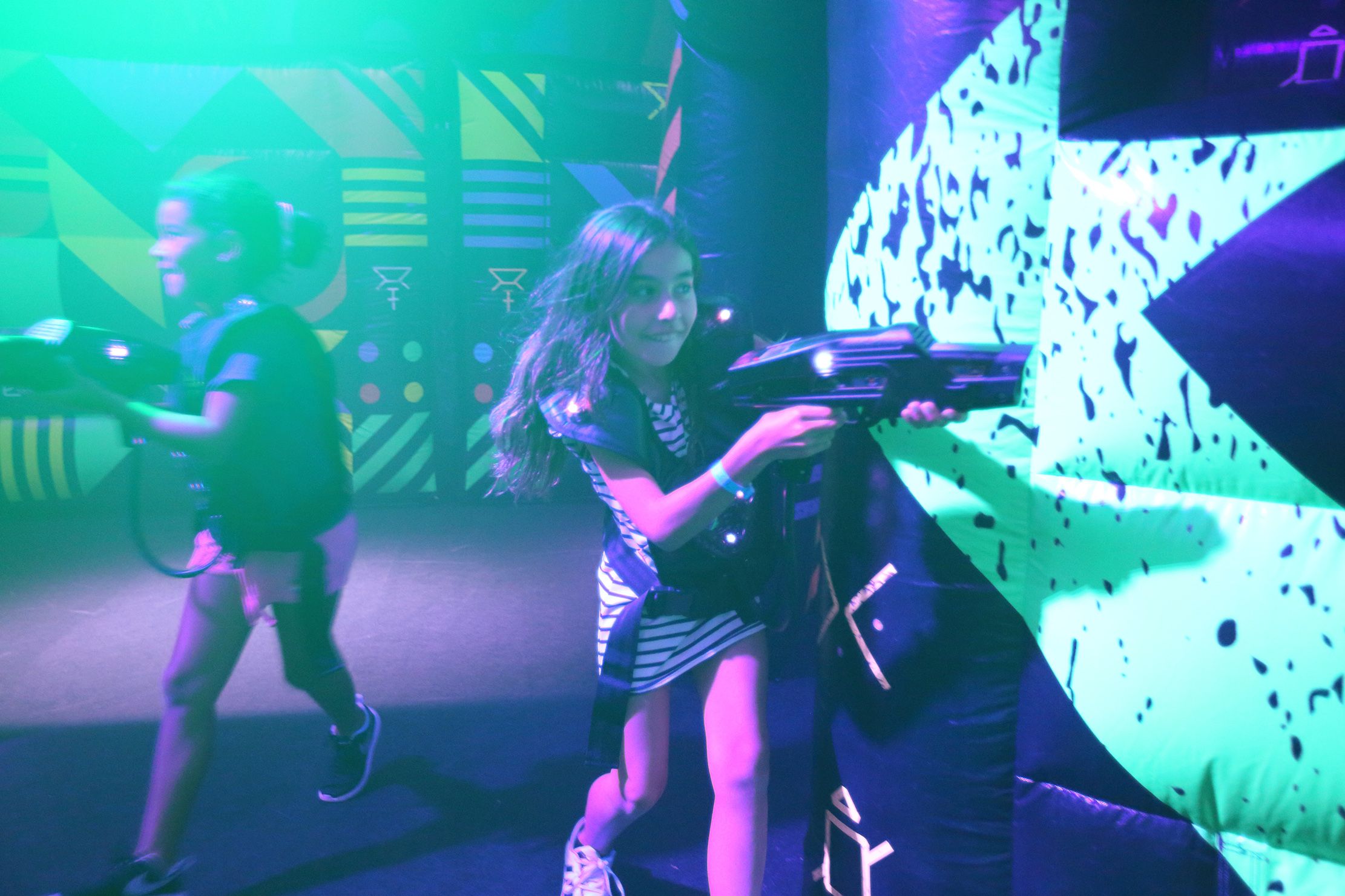 Kids playing laser tag on a ship