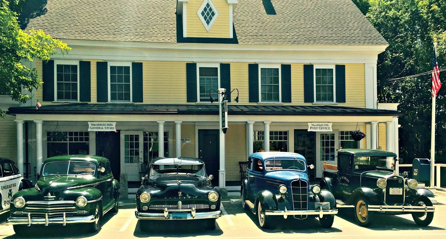 Old-time cars parked in front of Marshfield Hills General Store