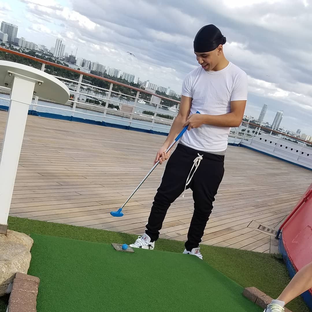 Person playing golf on a ship
