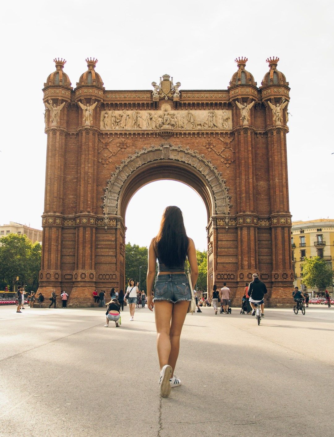 Girl standing in Placa Catalunya in Barcelona Spain