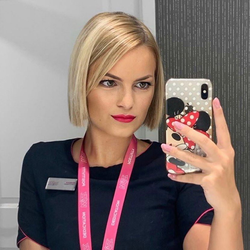 An unhappy looking flight attendant