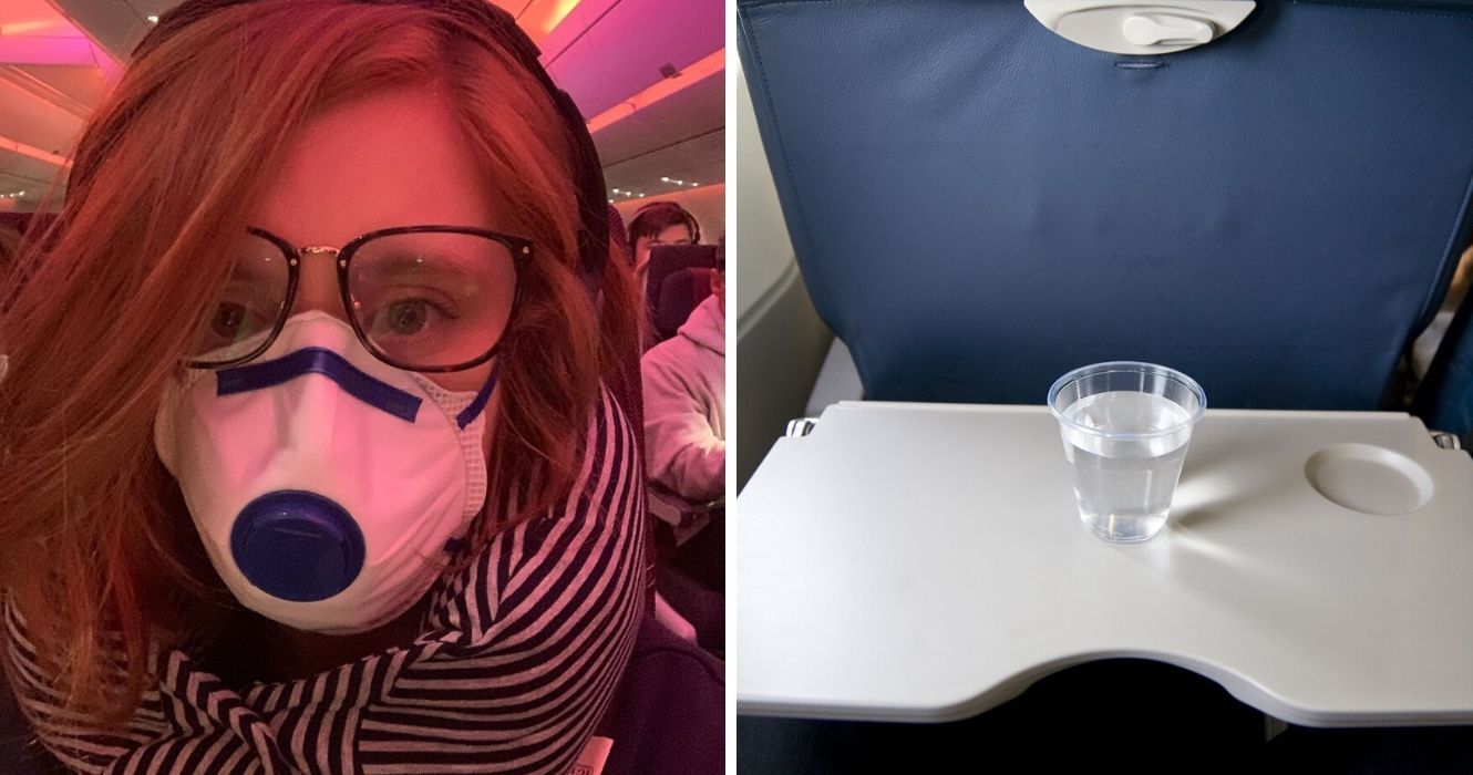 a girl wears a face mask on a plane, a cup of water on a plane tray