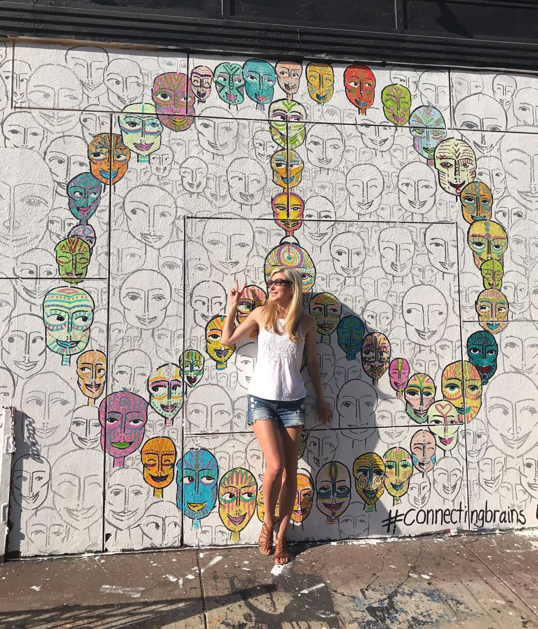 Girl posing in front of mural in Williamsburg Brooklyn