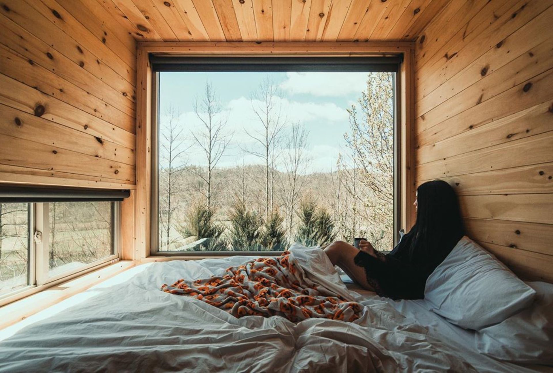 a girl sits in a cabin