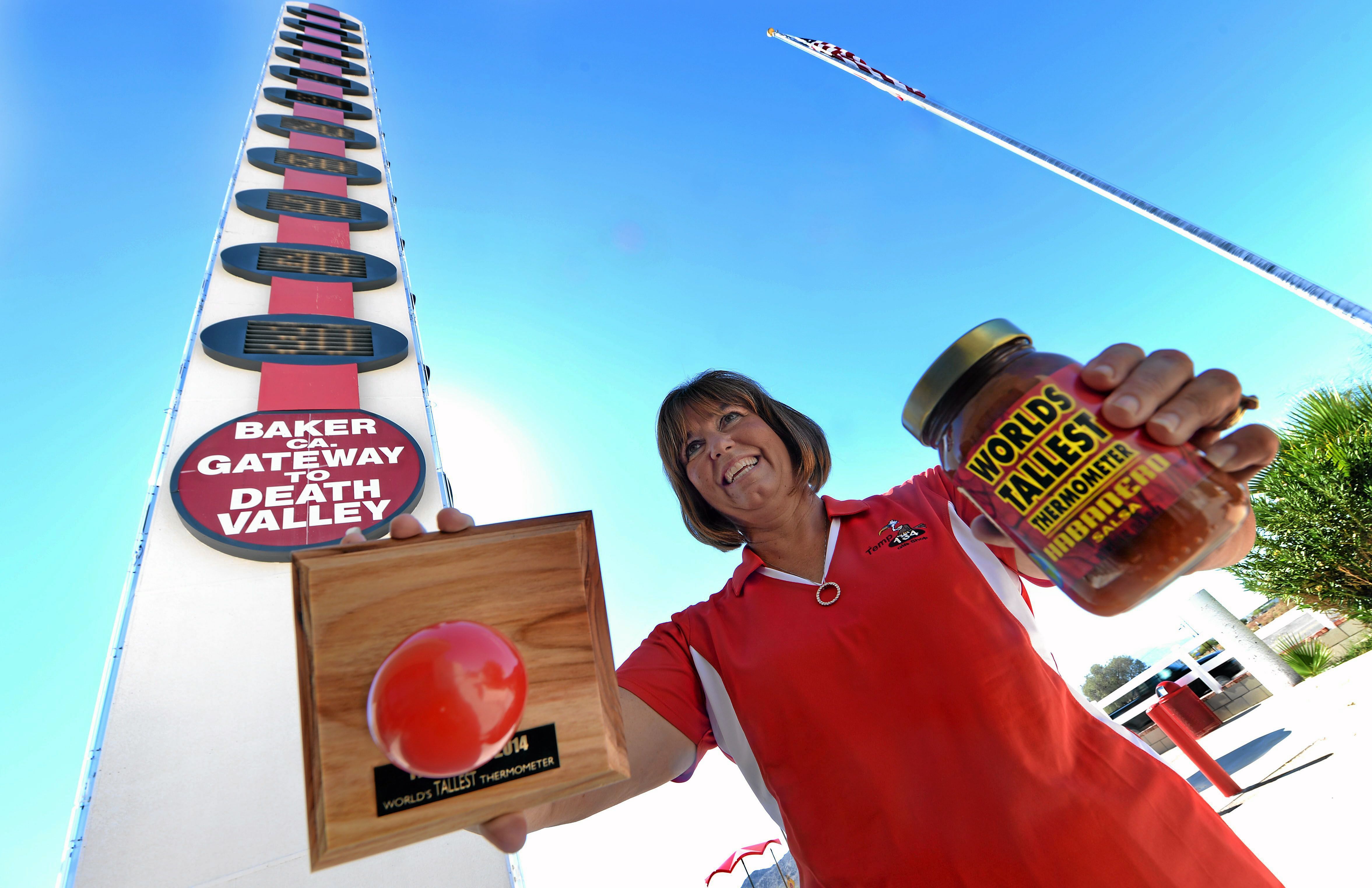 a woman working at the worlds tallest thermometer