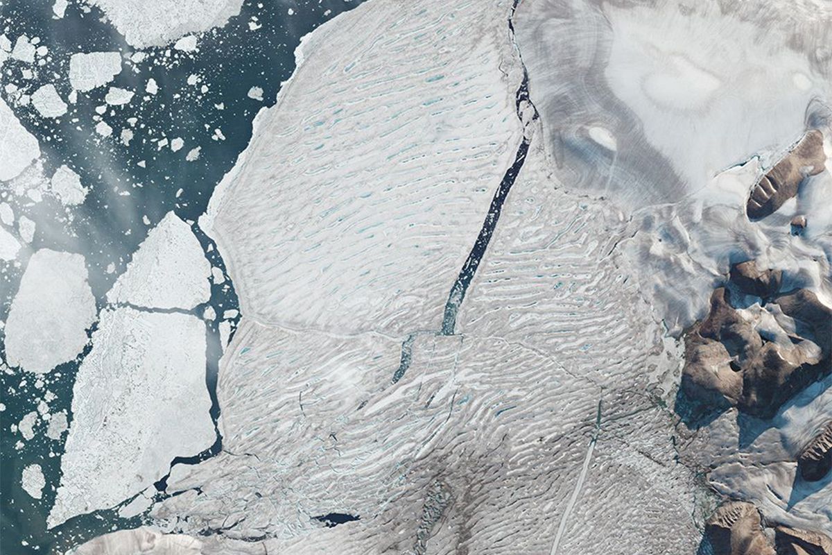 the milne ice shelf breaking apart in canada