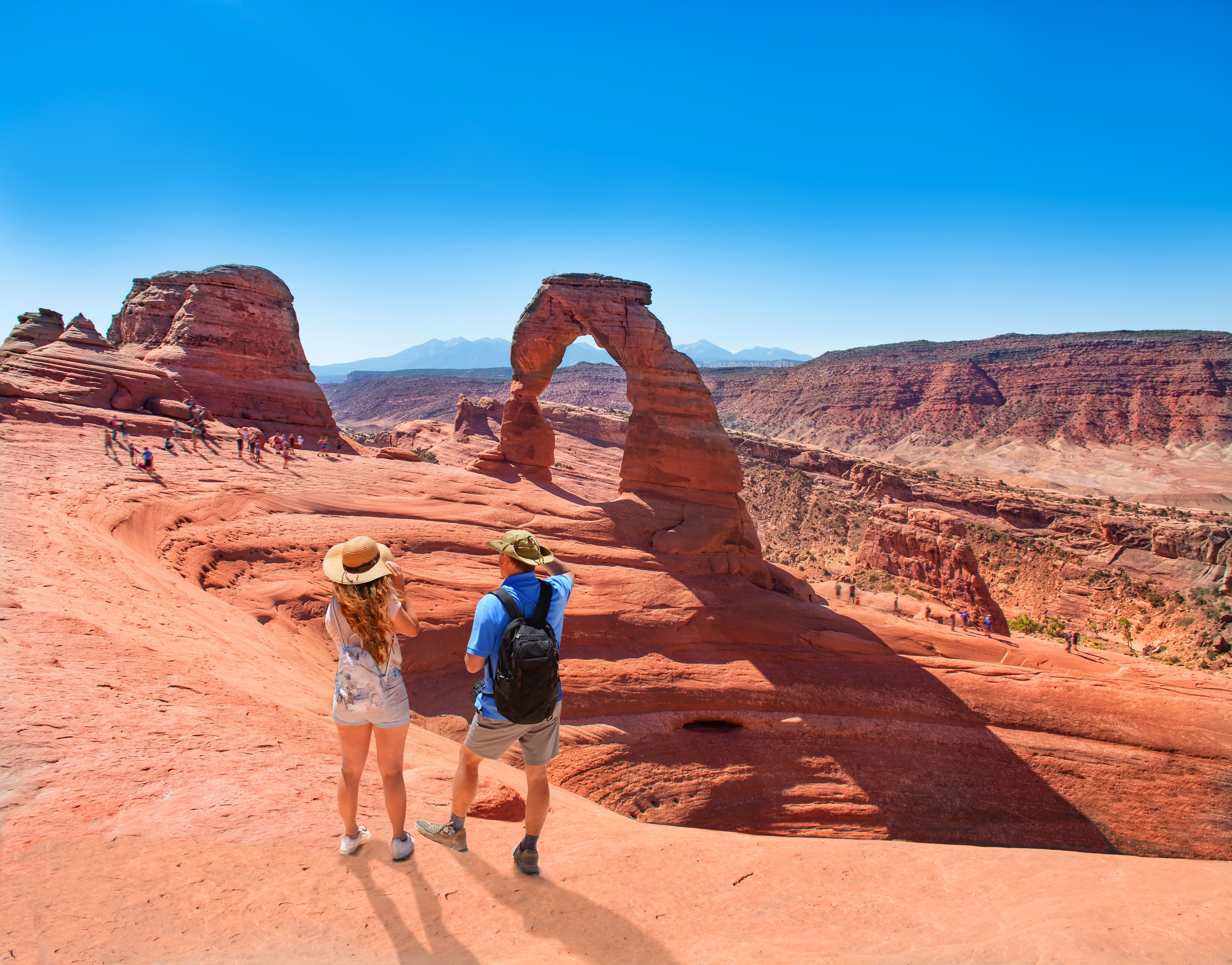 two people exploring the desert in moab, utah