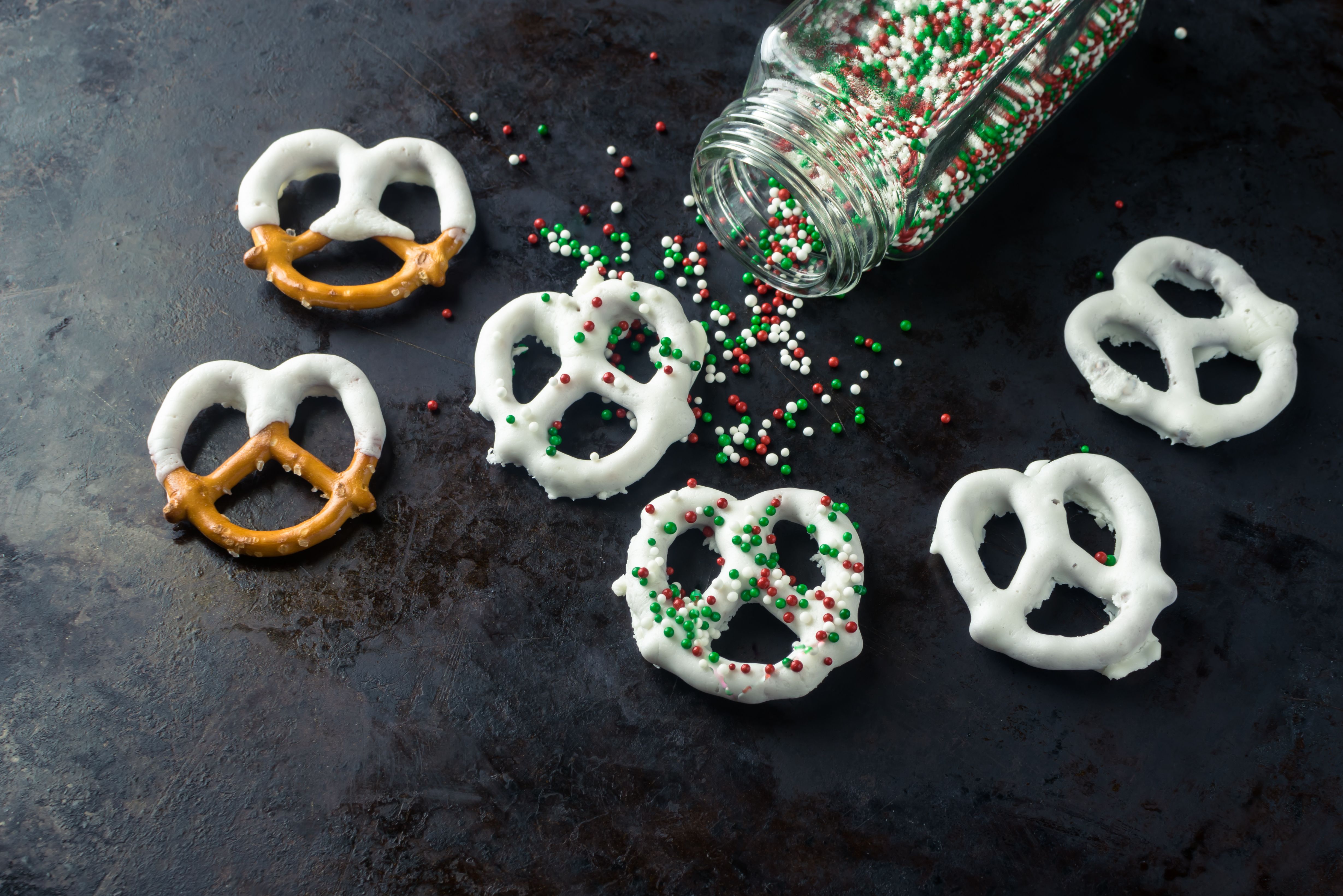 white chocolate-covered pretzels with holiday sprinkles