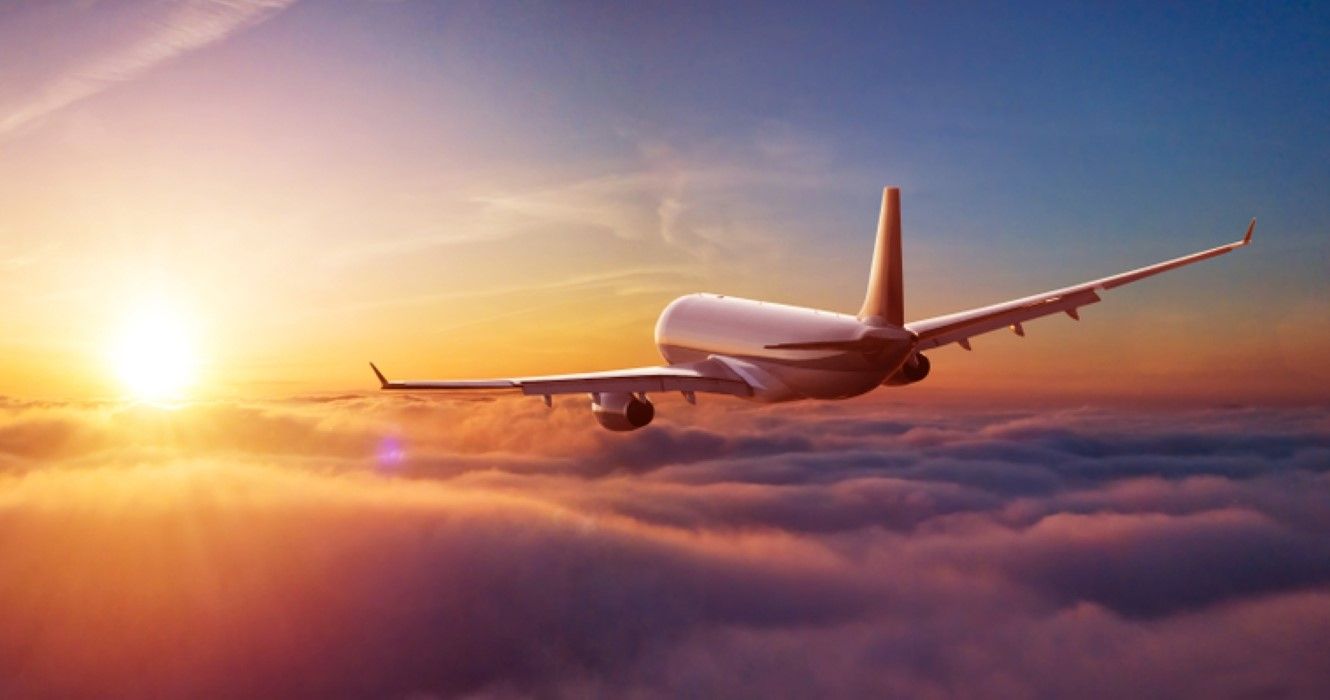 Airplane flying above clouds