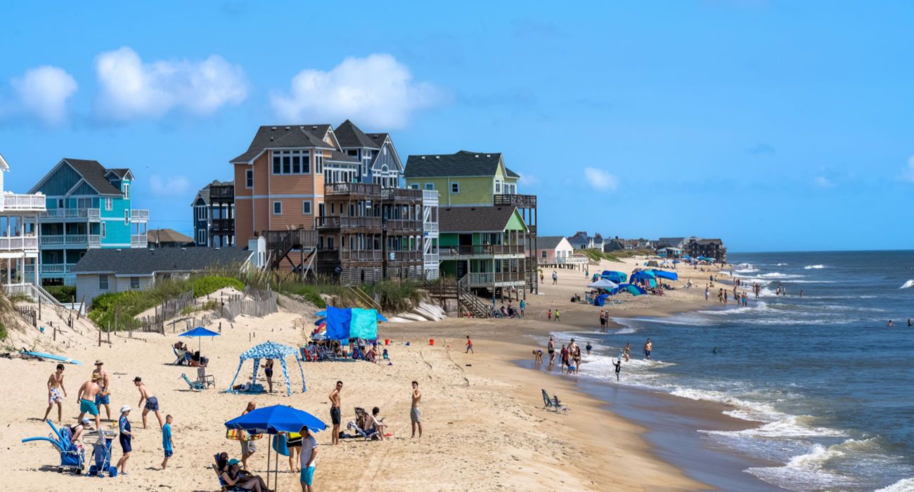 Vacation Homes and tourists along the beach in Rodanthe, North Carolina, United States