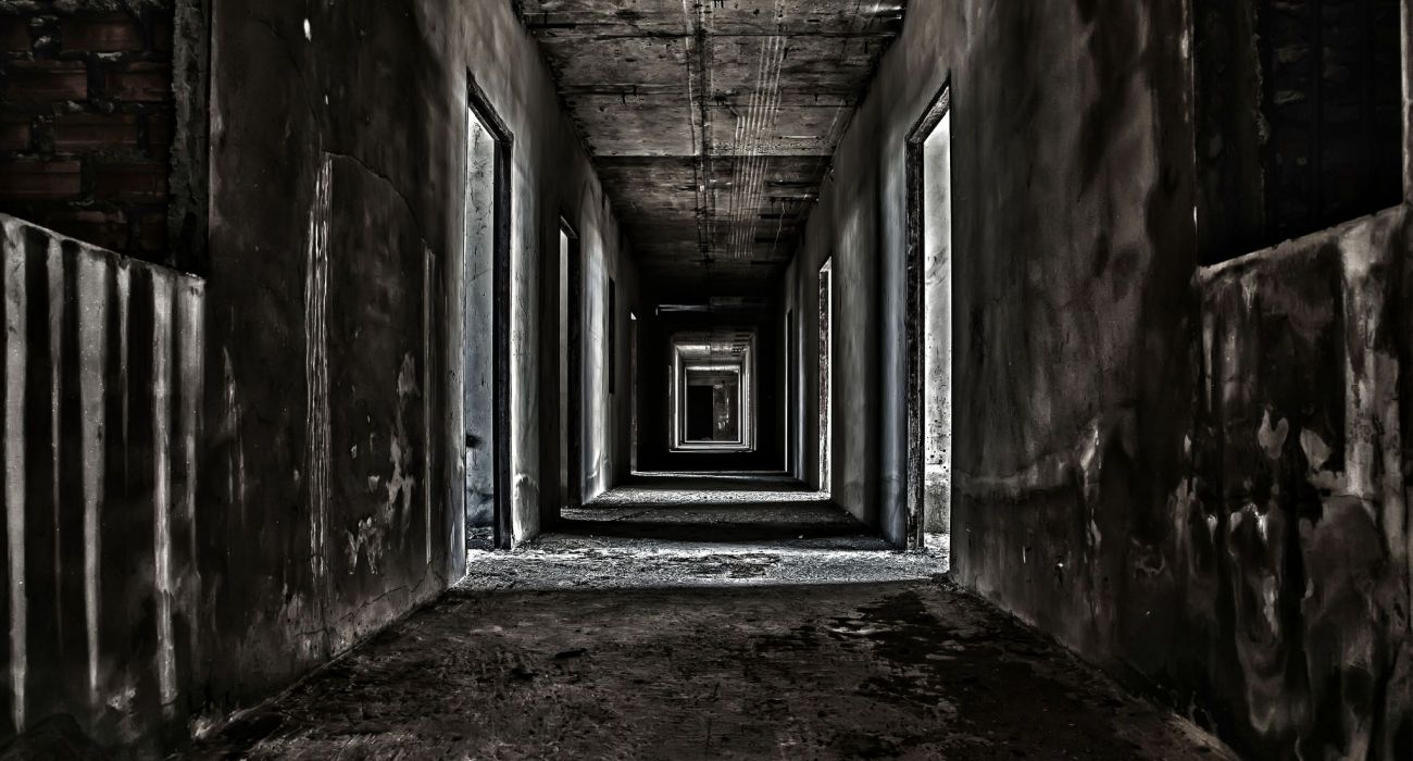 A scary hallway walkway in an abandoned building