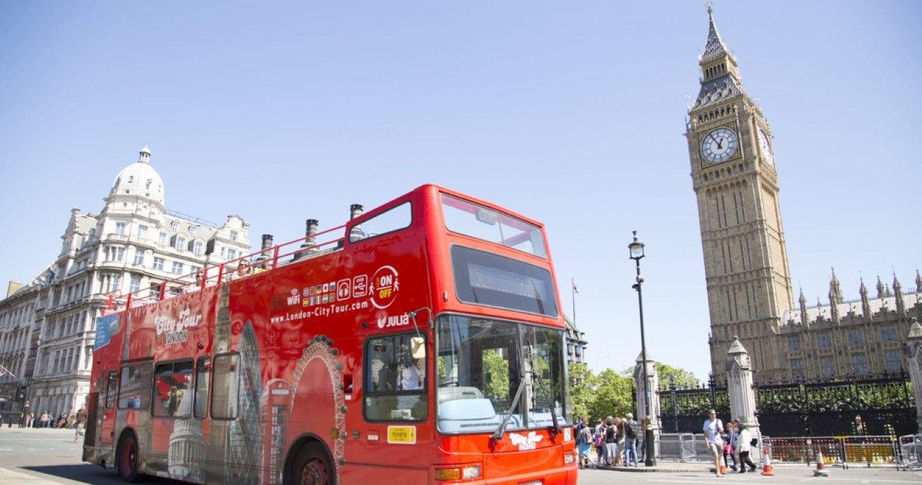 City tour bus passing Big Ben, London