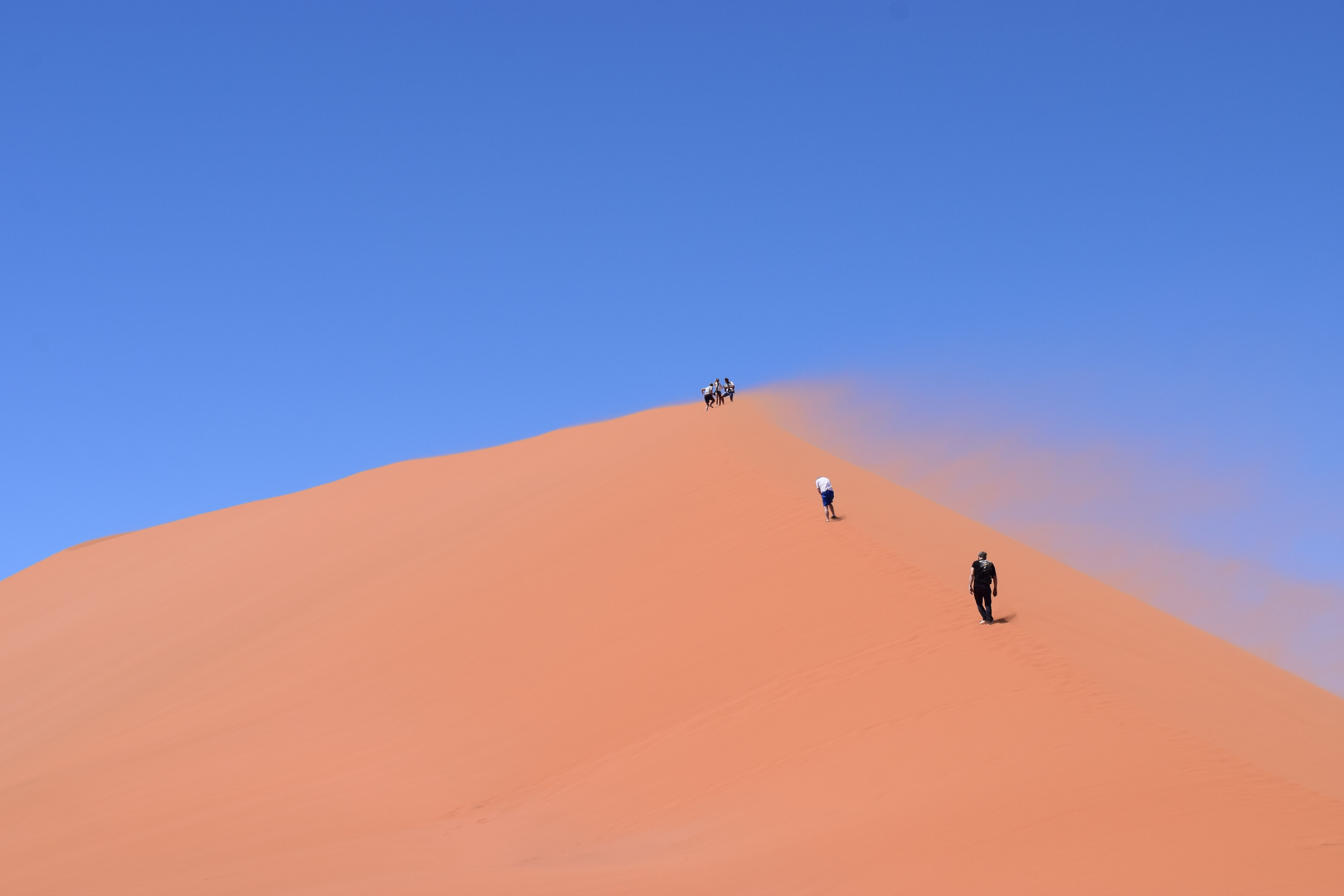 Tourist Climbing Up Dune 45