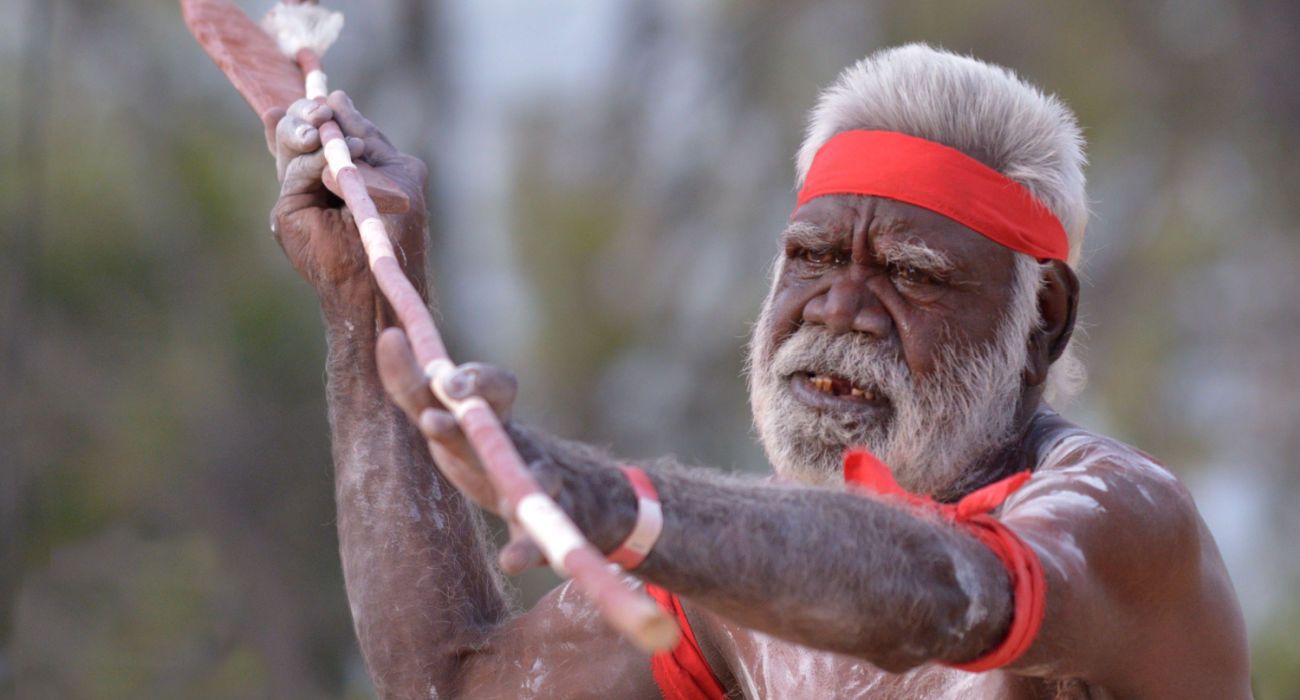 Aboriginal man holding a ceremonial weapon